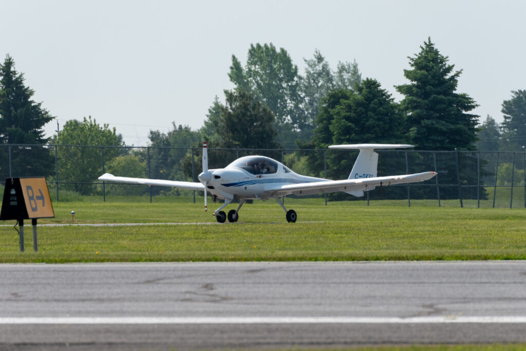 Diamond training aircraft on a runway at an airport

